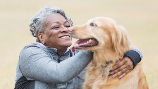 Happy women with dog after pelvic organ prolapse treatment